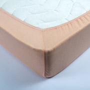 Трикотажне простирадло на гумці Lotus персикове